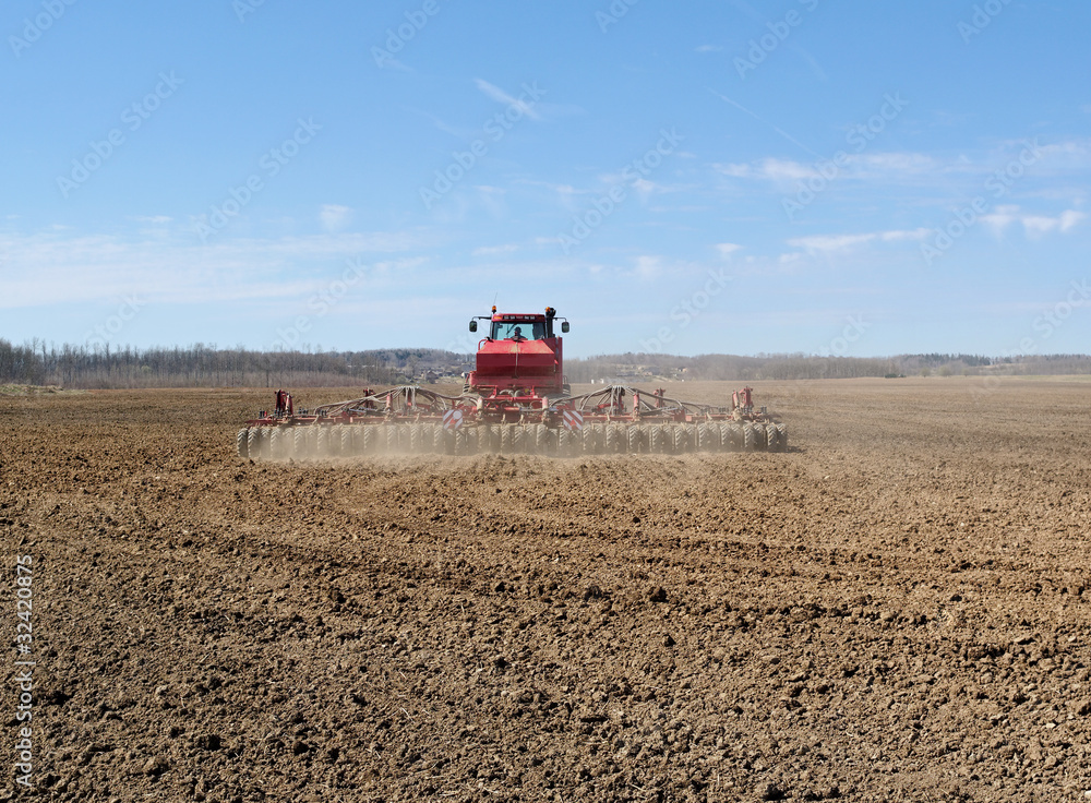 Fototapeta premium Tractor on a field.