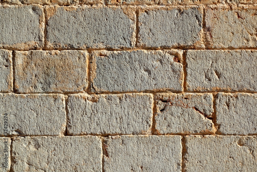 Fototapeta premium Castle masonry wall carved stone rows pattern texture