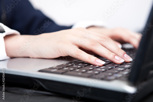 female hands on the keys typing