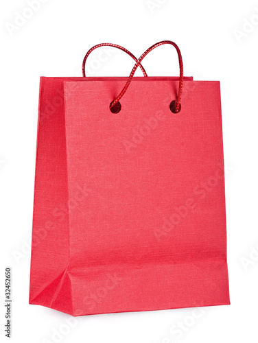 Red bag with purchases on the white