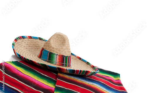 Serape and sombrero on a white background with copy space