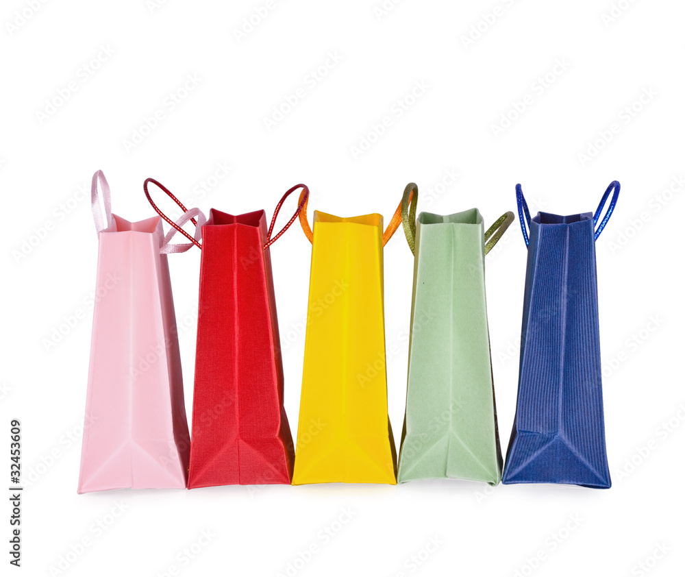 Assorted multi-color shopping bags on a white background