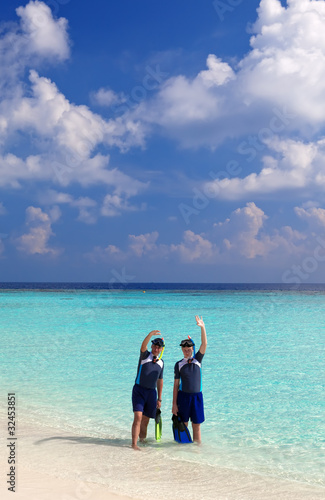 Two men in the sea with the equipment for a snorkeling