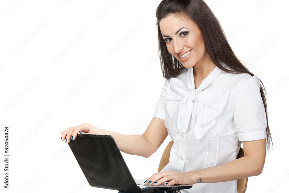 Young female working on laptop isolated on white Young female working on laptop isolated on white