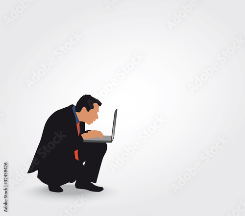Silhouette d'un homme consultant son ordinateur