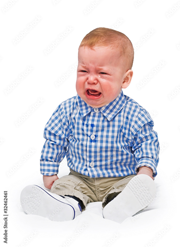 The crying boy in tears, on white background The crying boy in tears, on white background