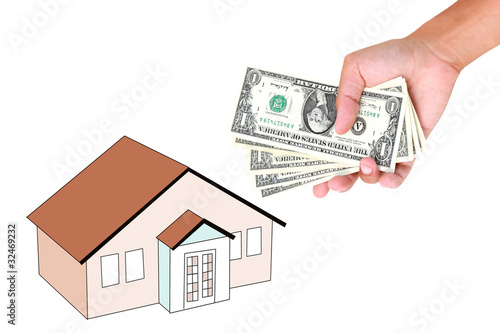 Hands with money and miniature house on a white background