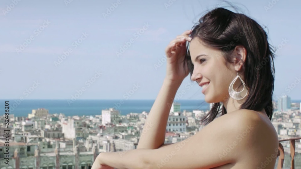 two girls looking at Havana cityscape from terrace two girls looking at Havana cityscape from terrace