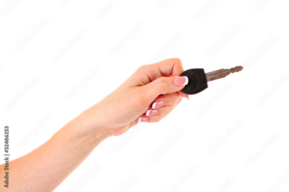 Woman hand with keys isolated on white Woman hand with keys isolated on white