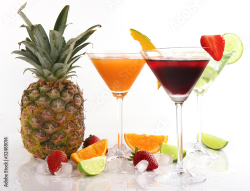 Tropical Martini drinks with fruits on white background