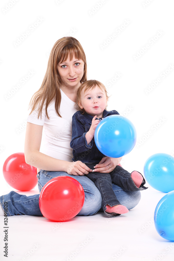 Happy family. Mum and the small daughter play balloons. Happy family. Mum and the small daughter play balloons.