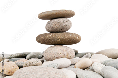 Stack of pebbles isolated on the white