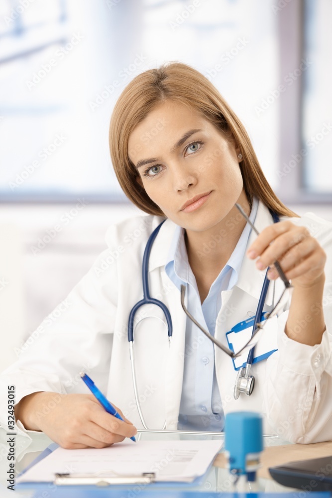 Portrait of attractive female doctor in office