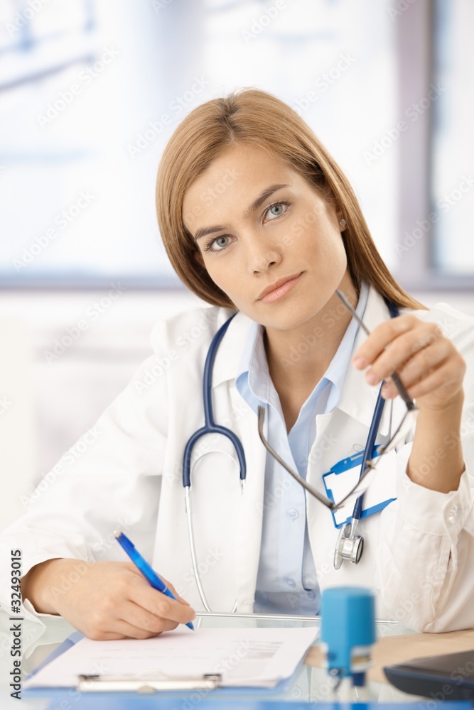 Portrait of attractive female doctor in office Portrait of attractive female doctor in office