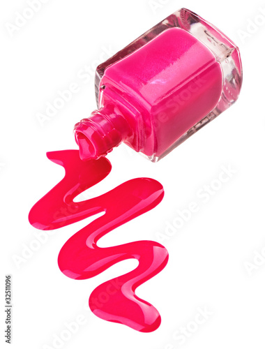 Bottle of pink nail polish with enamel drop samples, isolated on photo