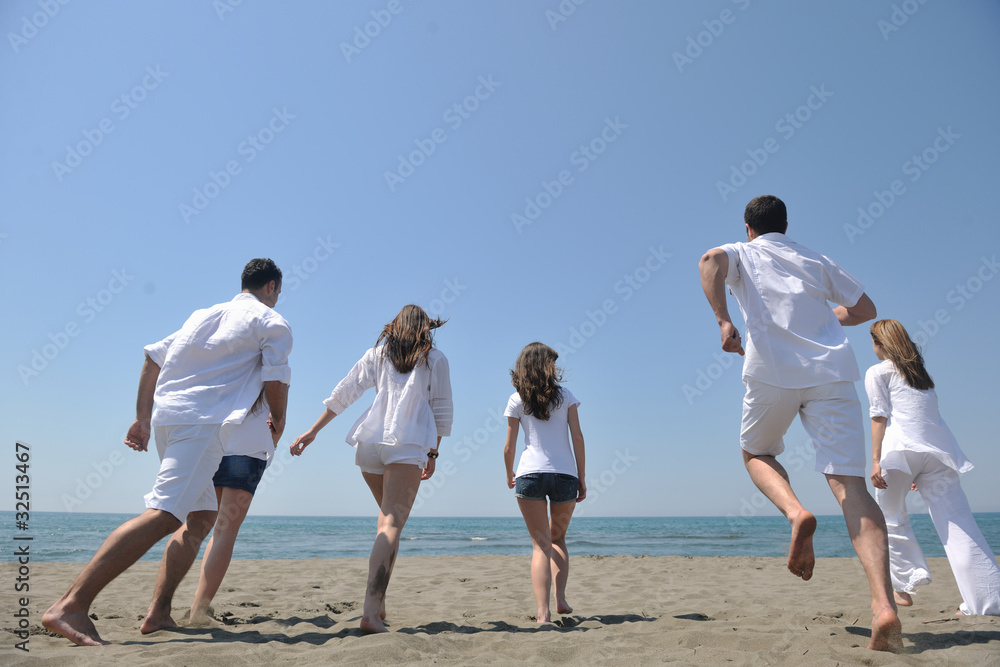 happy people group have fun and running on beach