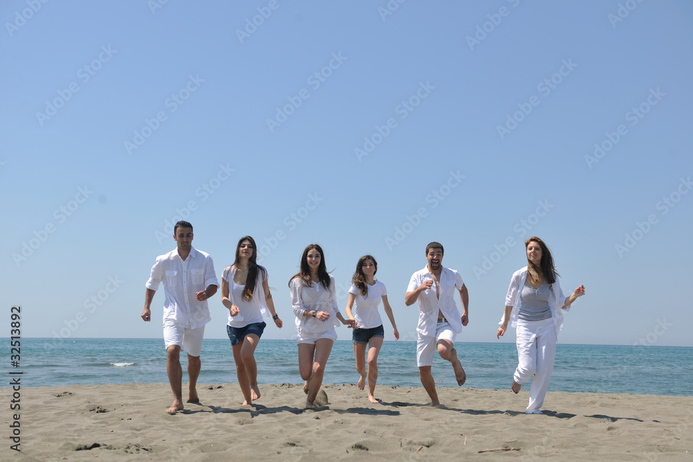 happy people group have fun and running on beach happy people group have fun and running on beach