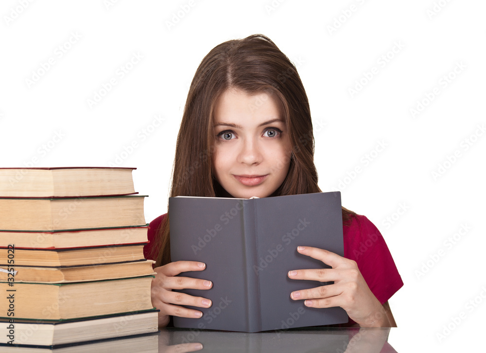 Teen girl with lot of books around, isolated on white Teen girl with lot of books around, isolated on white
