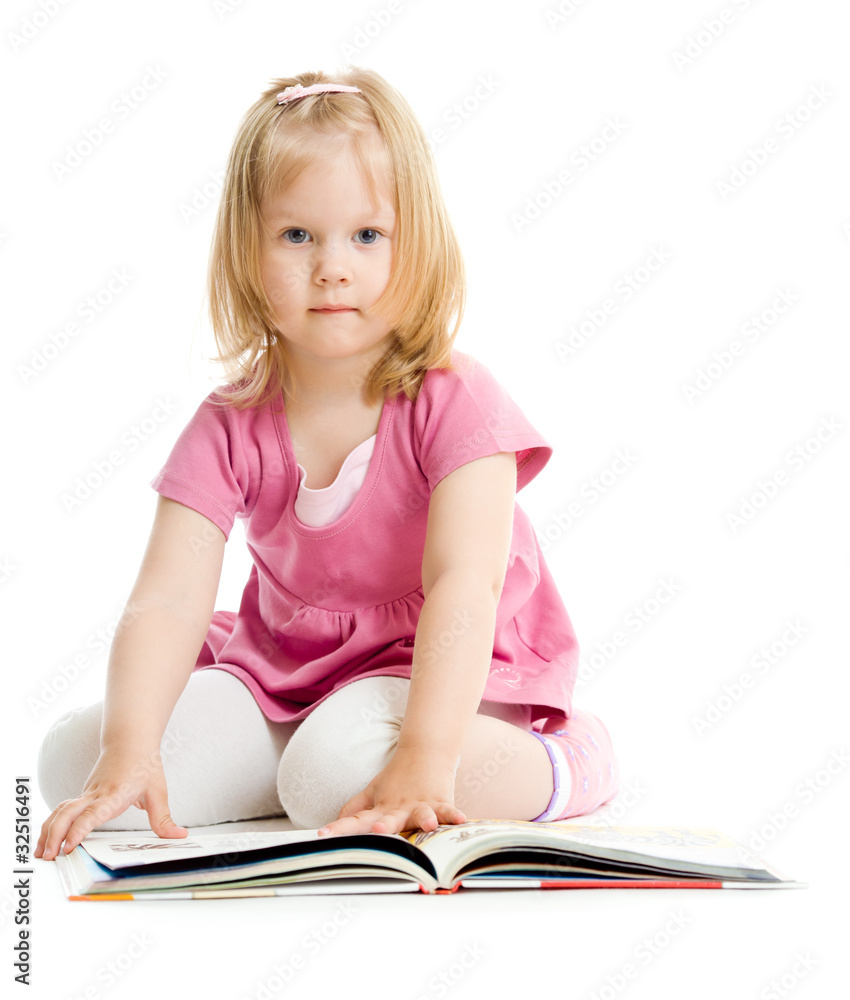 Little girl reading book on floor isolated on white Little girl reading book on floor isolated on white