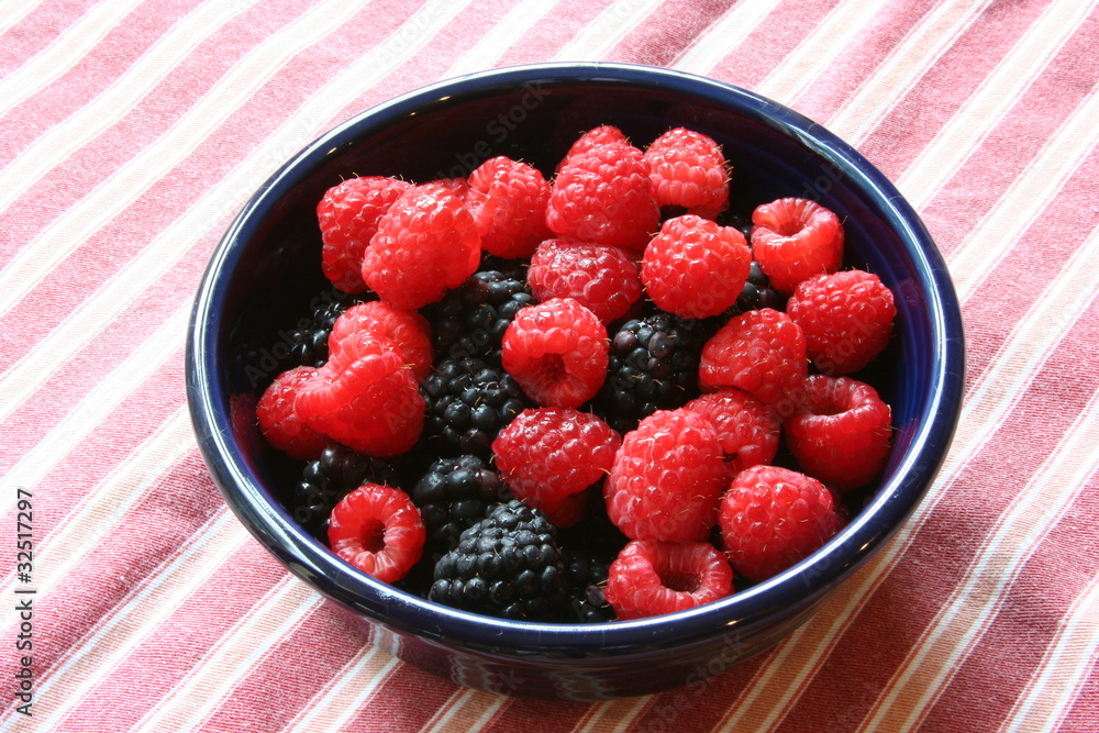 Raspberries and blackberries in a bowl Raspberries and blackberries in a bowl