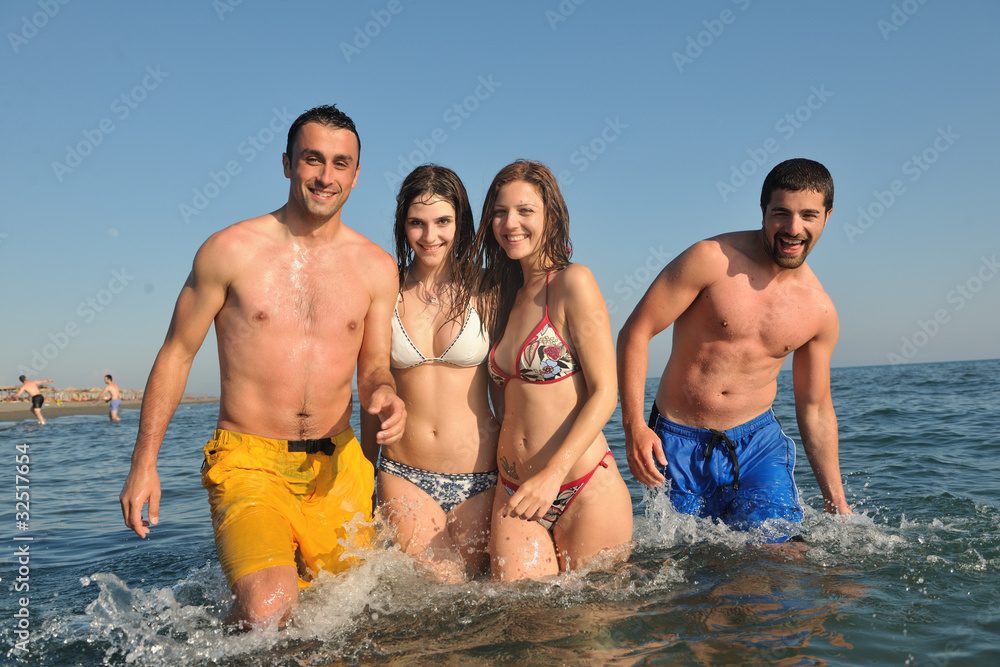 happy people group have fun and running on beach happy people group have fun and running on beach
