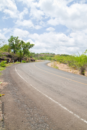 Road beside Mountain and blue sky in Countryside Pha Taem Nation