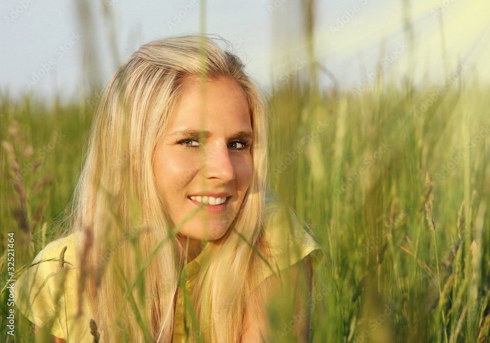 Beautiful blond girl in grass Beautiful blond girl in grass