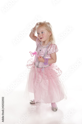 pretty little girl laughing in pink fairy princess dress
