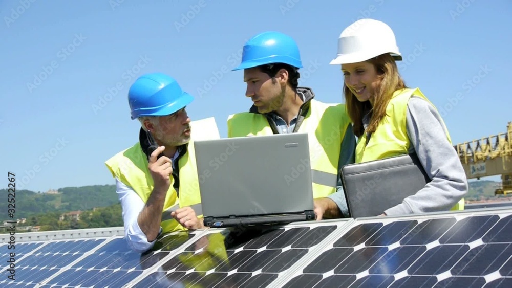 Engineers checking solar panels setup Engineers checking solar panels setup