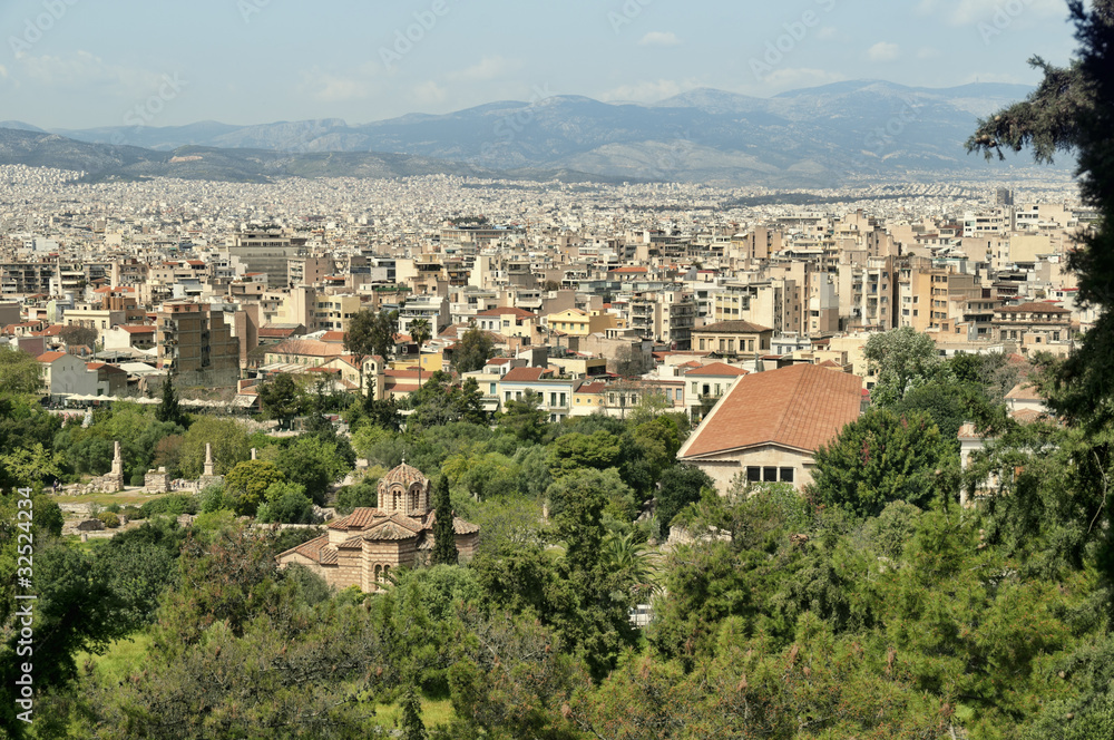 Athens` skyline with Church in The Ancient Agora