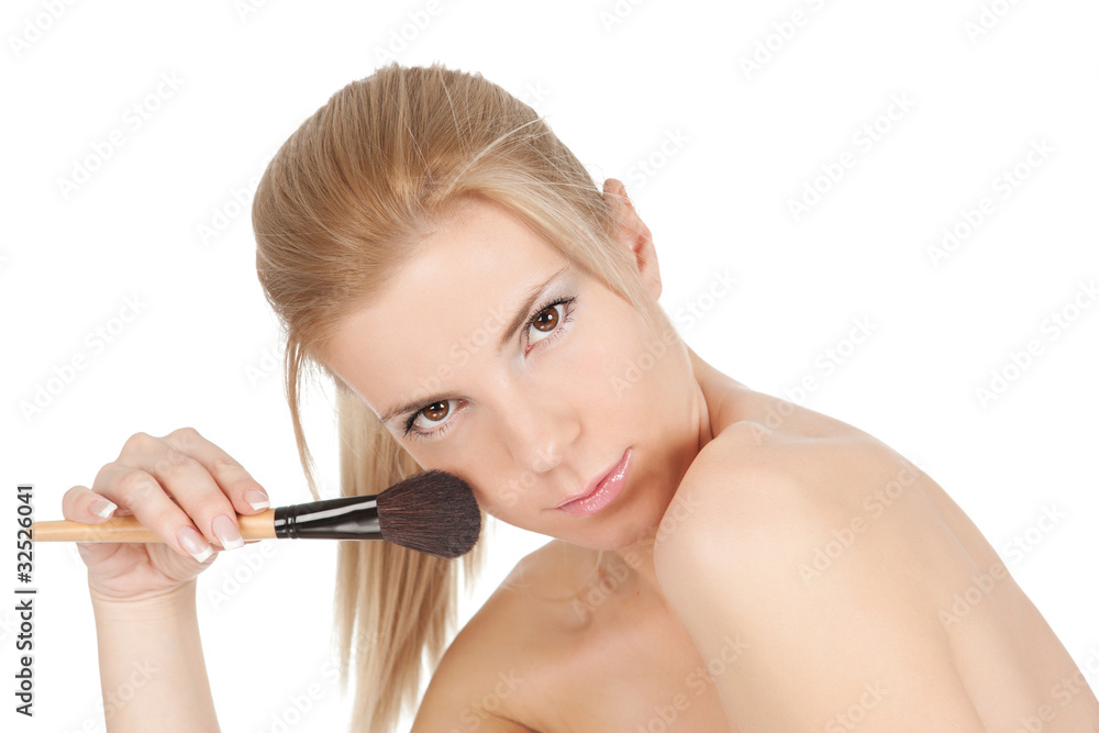 Beautiful young adult woman holds the make-up brush Beautiful young adult woman holds the make-up brush