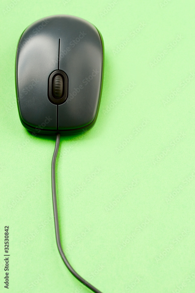 Computer mouse isolated on the green background Computer mouse isolated on the green background