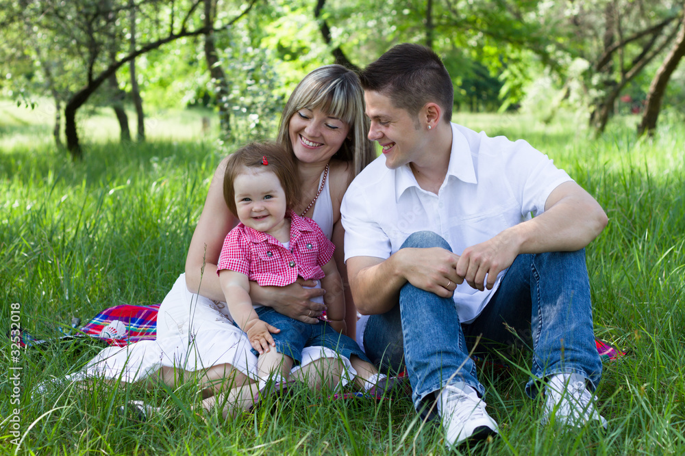 Young family of three on a picnic
