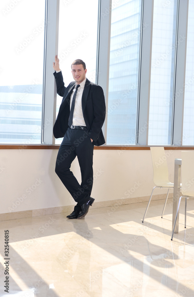 young business man alone in conference room young business man alone in conference room