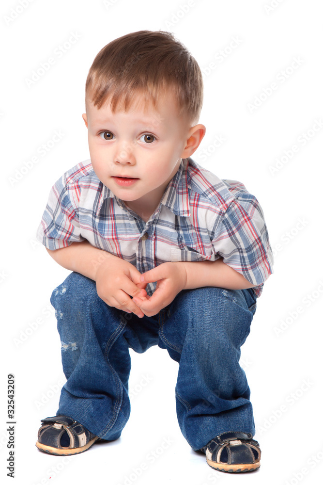Cute little boy sitting looking at camera. concept. Cute little boy sitting looking at camera. concept.