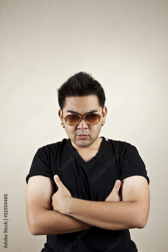 Seriously, A man wearing sunglasses crossing arm, seriously. Seriously, A man wearing sunglasses crossing arm, seriously.