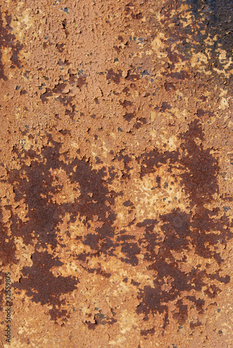 Worn-out weathered rusty metal texture with peeled off paint