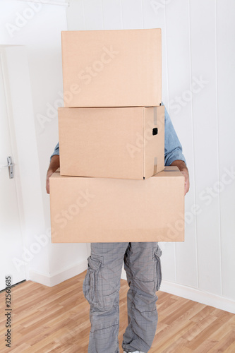 Man holding pile of boxes