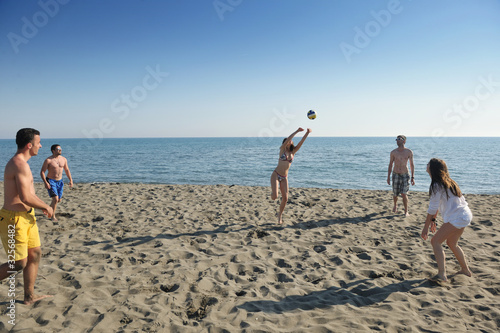 young people group have fun and play beach volleyball