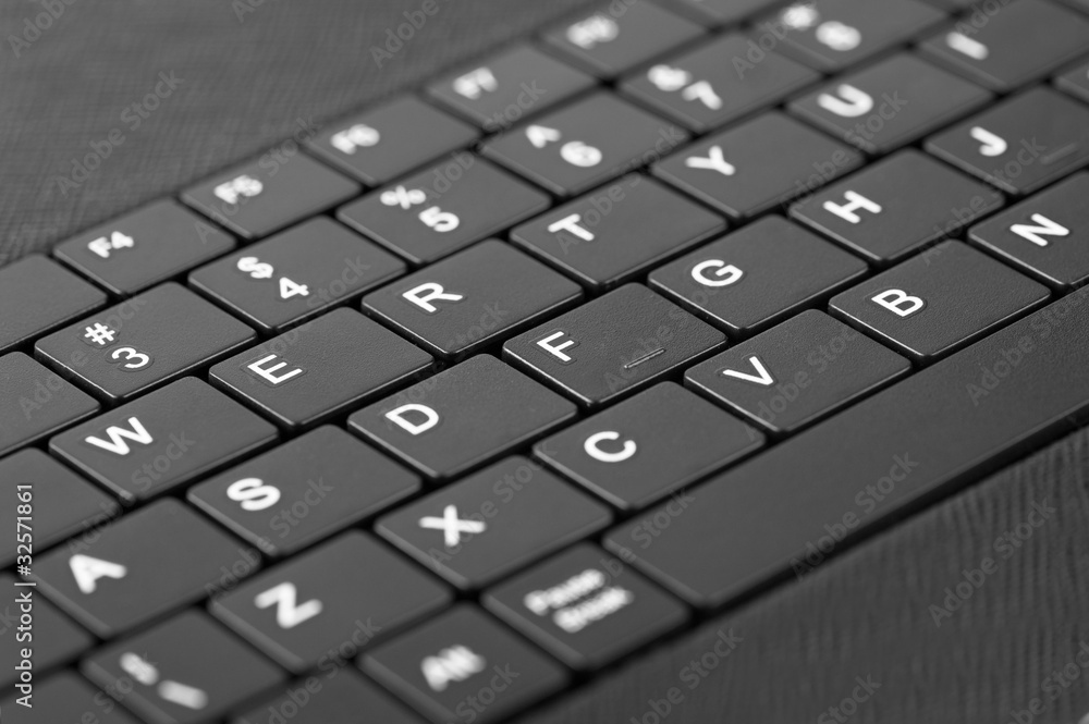 Technology background: Macro of laptop keyboard Technology background: Macro of laptop keyboard