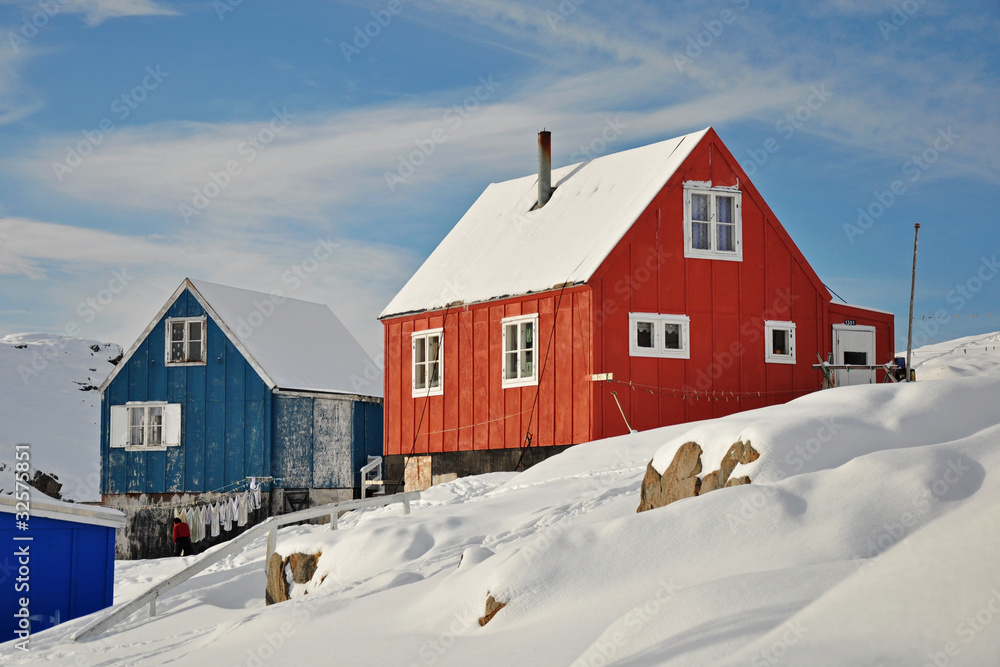 Red and blue houses in winter, Greenland
