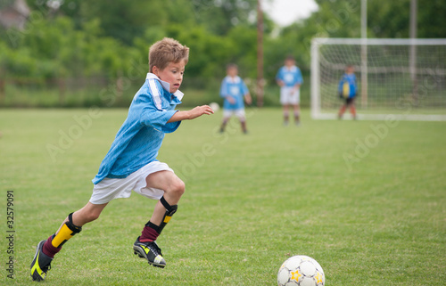 Little Boy playing soccer