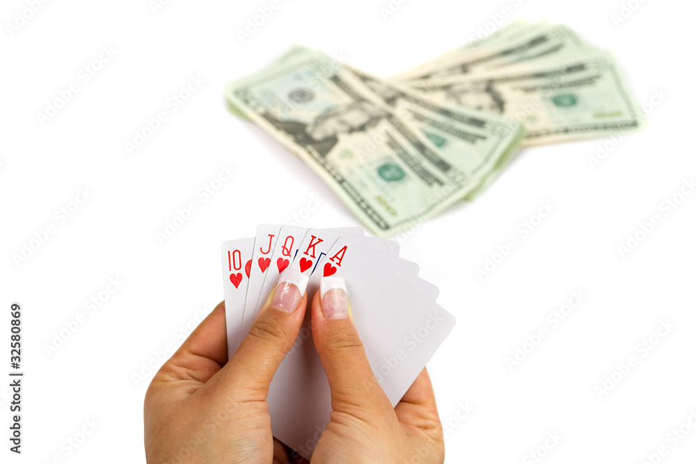 Royal poker in female hand with money background Royal poker in female hand with money background