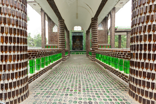 buddhist temple bilt with empty glass bottle photo