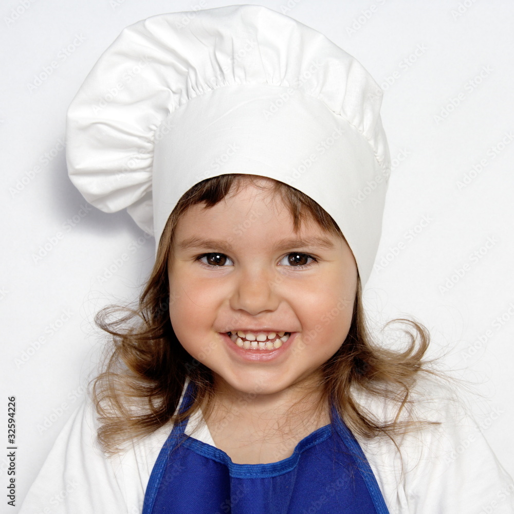 Little Cute Girl in Cook's Cap Portrait Little Cute Girl in Cook's Cap Portrait