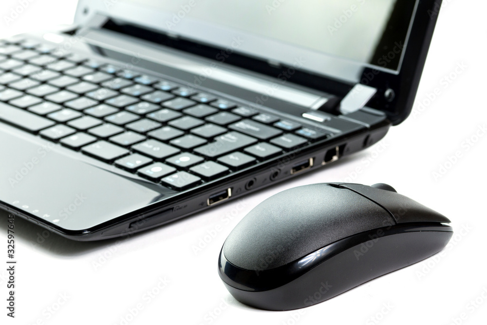 Mouse and netbook isolated on white Mouse and netbook isolated on white