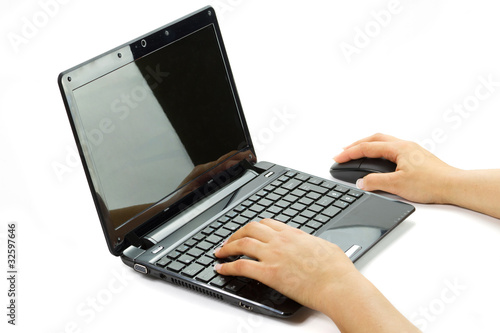 Female hands wrighting on laptop