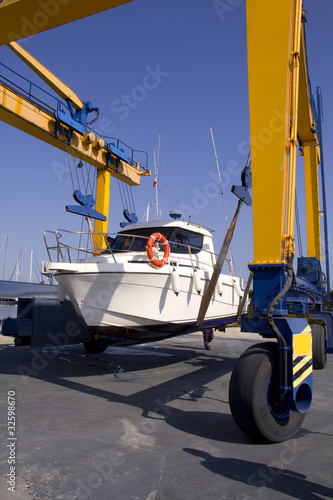 boat crane travelift lifting motorboat © lunamarina