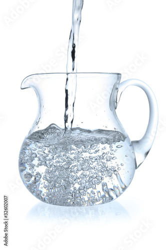 Stream of water falling in jug