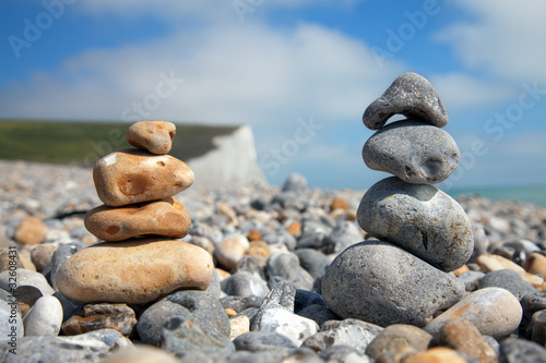 Two stacks of pebble stones on beach